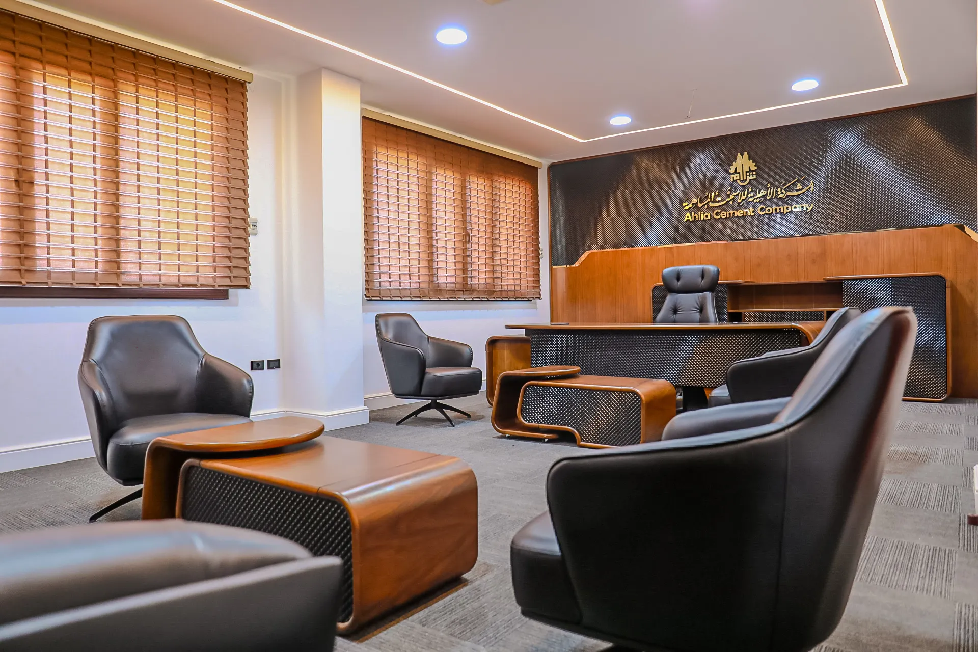 The boardroom table and leather chairs